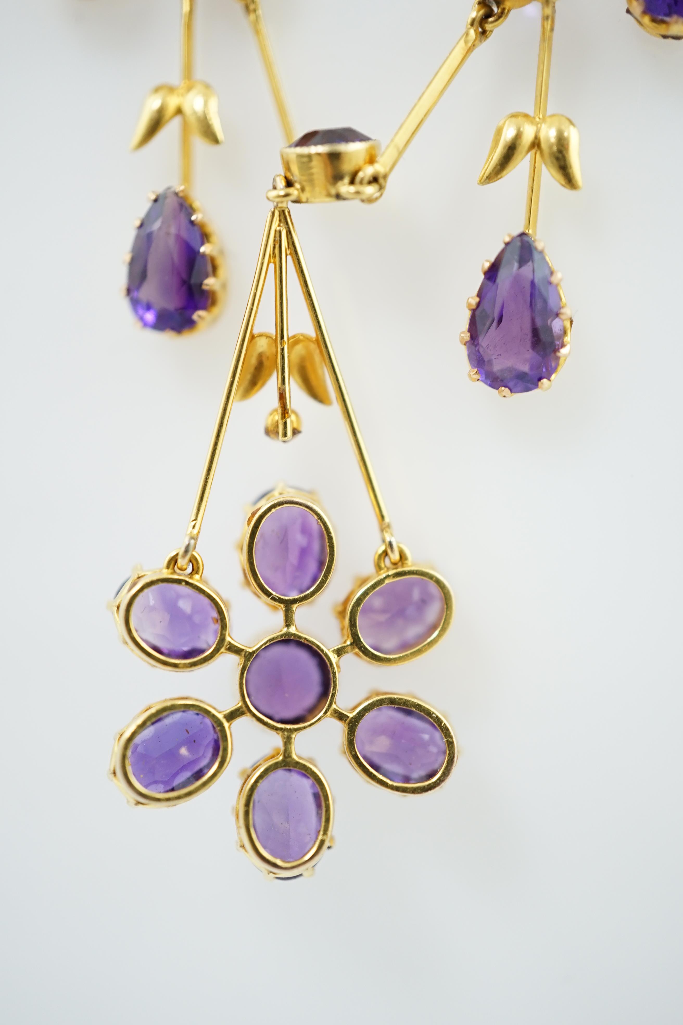 An Edwardian gold, and amethyst cluster drop pendant necklace